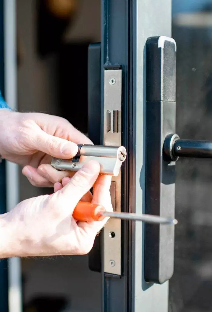 Lock installation in a modern home using tools for security enhancement and repair