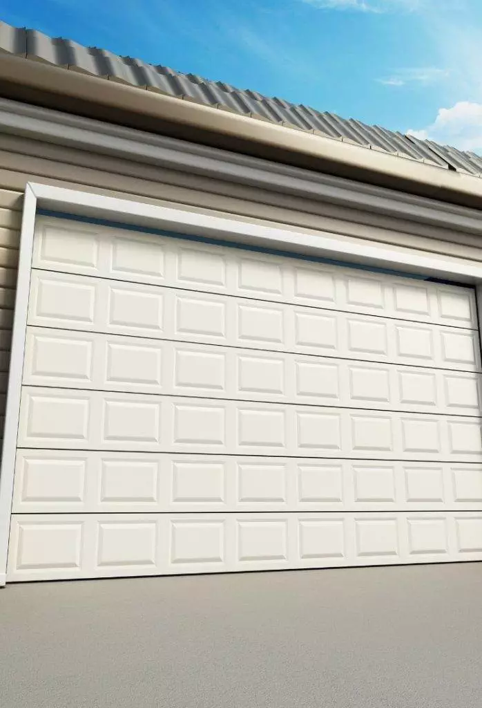 Garage door view against a clear blue sky showcasing modern white design and subtle architectural details