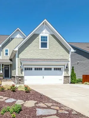 Custom steel garage doors enhance the curb appeal of homes in Edmonton, showcasing craftsmanship in residential design Custom steel garage doors enhance the curb appeal of homes in Edmonton, showcasing craftsmanship in residential design