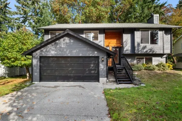 Residential garage door in Edmonton enhances home exterior with modern design and functional features suitable for various weather