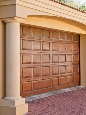 Beautiful wooden residential garage doors in Edmonton showcase charming architecture and detail Beautiful wooden residential garage doors in Edmonton showcase charming architecture and detail