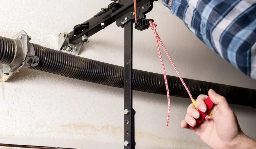 Extension spring repair on residential garage door