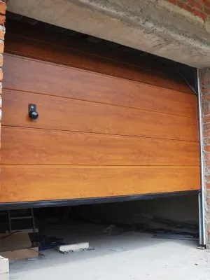 Professional garage door maintenance in progress for smooth operation and durability Professional garage door maintenance in progress for smooth operation and durability